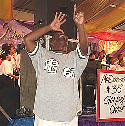 Photo: Noah Butler, American Sign Language interpreter, interpreting for a gospel choir.